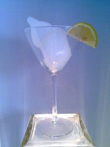 sculpture art of martini glass with condom filled with cum