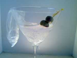 sculpture art of martini glass with condom filled with cum